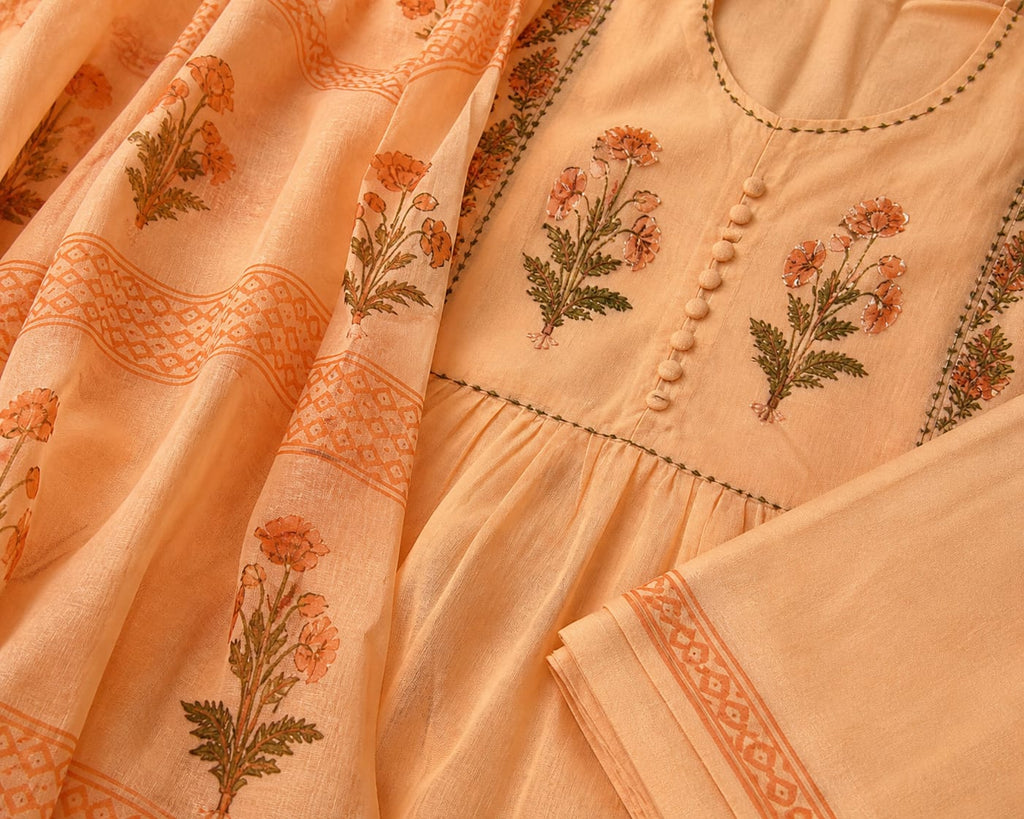 Pastel Peach colour Handblock elephant printed Straight 3 pcs Kurta set for women with Sequin handwork detailing on neckline with Tassels